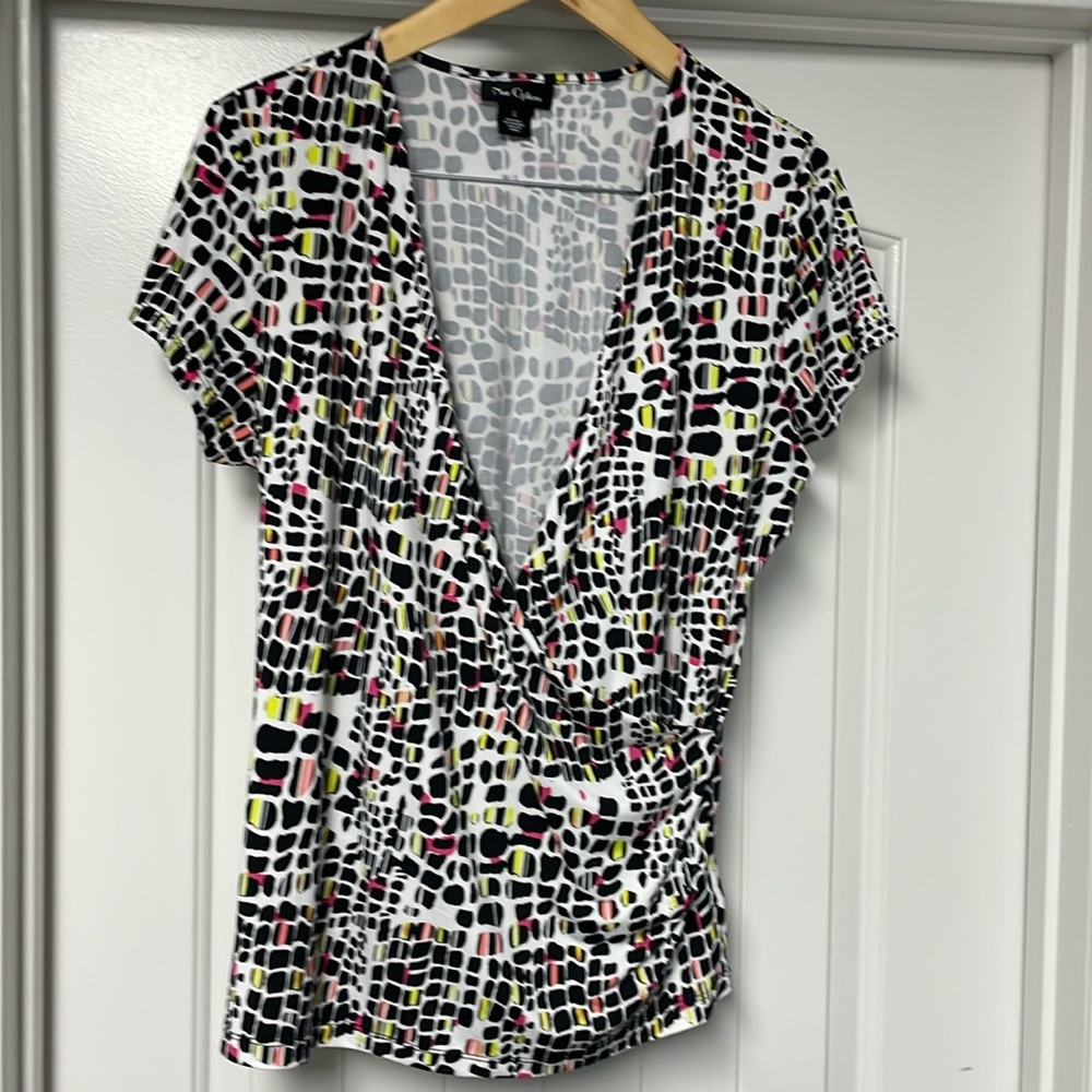 Black, white wrap shirt, size L. Matching skirt in closet!